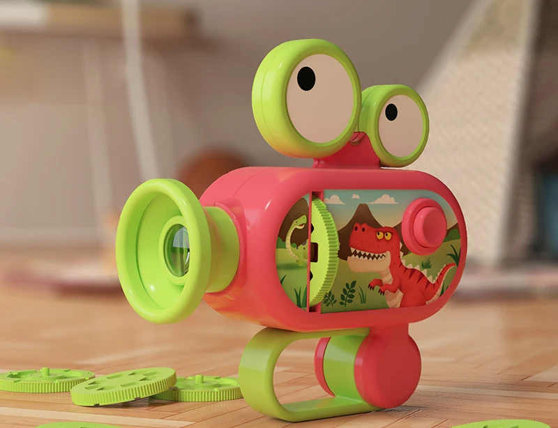 Red and green projector flashlight with dinosaur artwork and picture discs