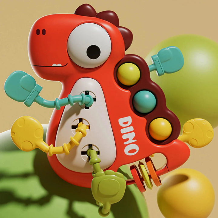 Red dinosaur pull toy with colorful cords, pop bubbles and rotating rings