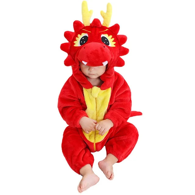 Baby in a red dragon romper with a yellow belly and horned character hood.