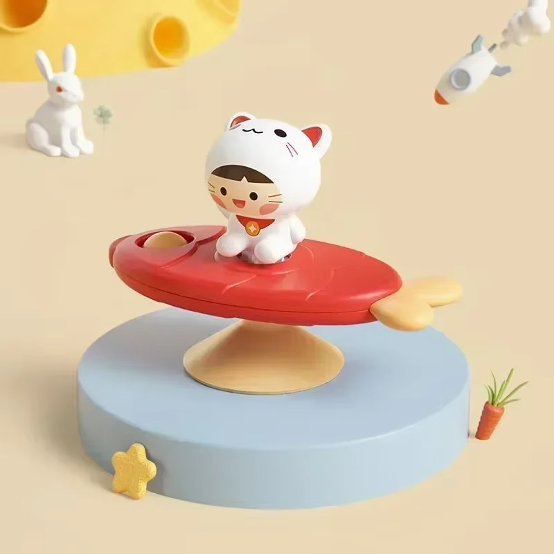 Cat character on a red fish-shaped spinner with a yellow tail and suction-cup base