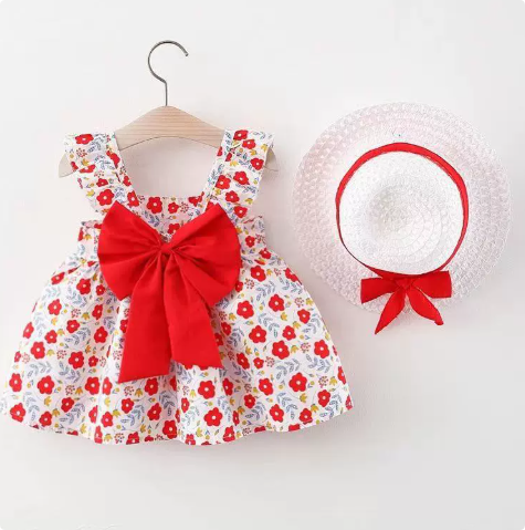 Red floral dress with a large red bow and coordinating straw hat
