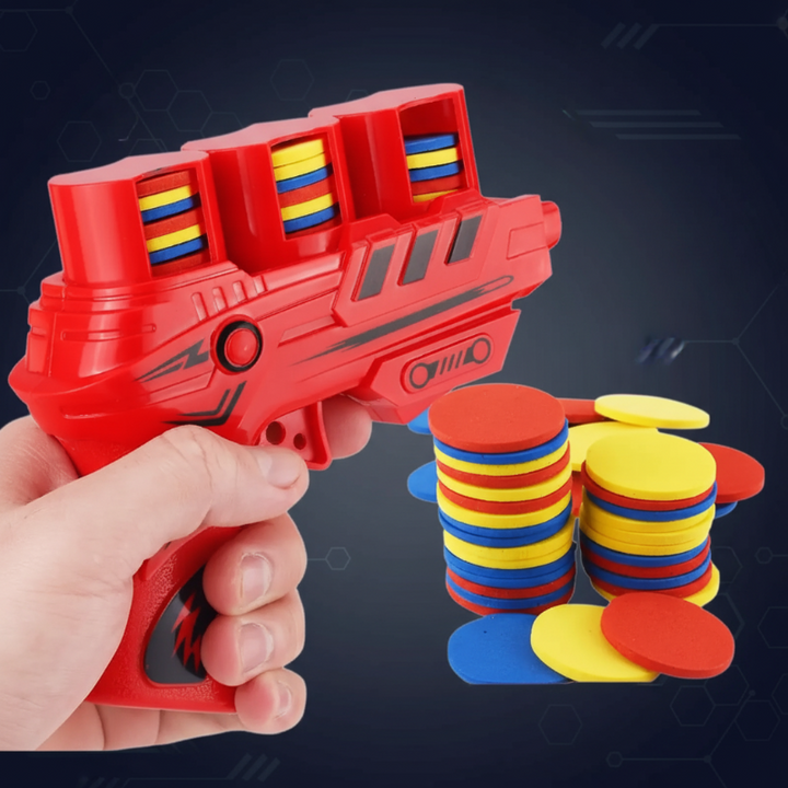 Red foam disc blaster held in one hand beside stacks of colorful foam discs