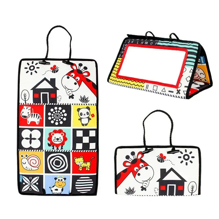 Red-framed sensory mirror with animal illustrations and patterned fabric panels