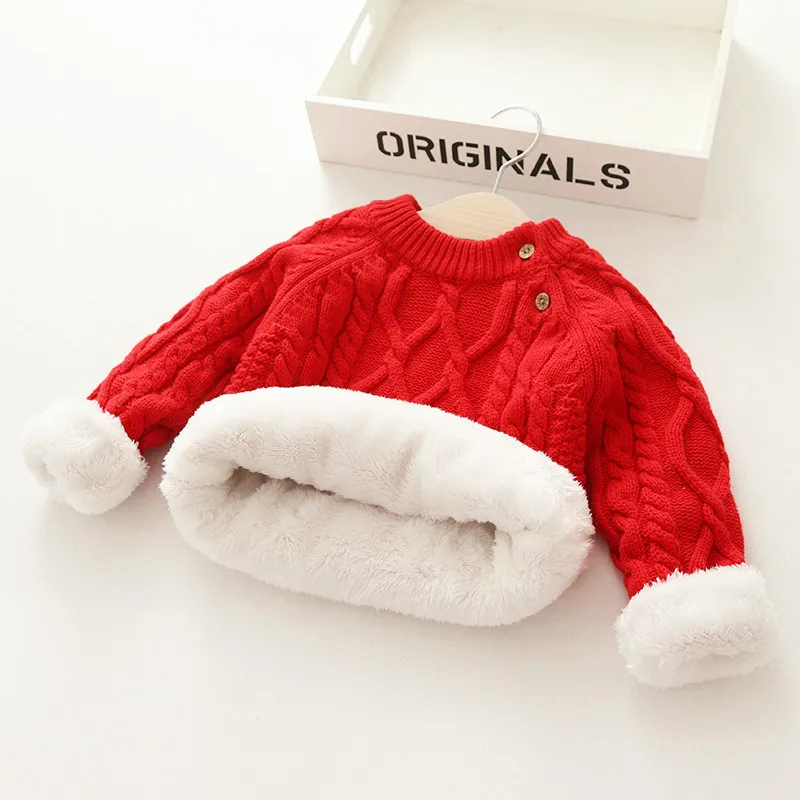 Red cable-knit sweater with the hem and cuffs turned back to reveal plush white lining.