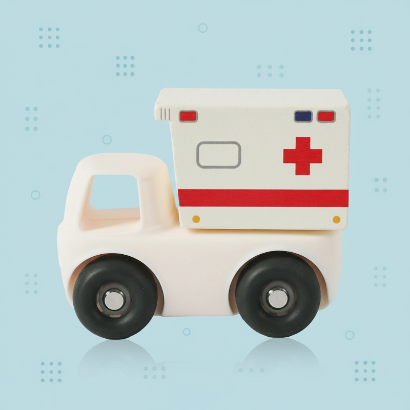 White ambulance truck toy with red side markings and black wheels