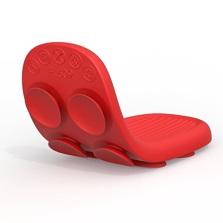 Red silicone sensory strip bent into a curve to show the ridged face and suction-cup back.
