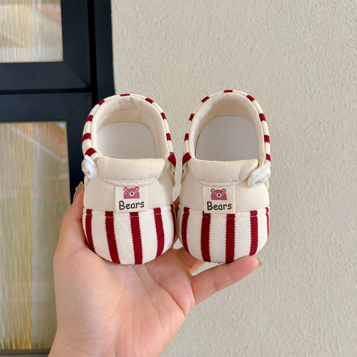 Red-and-cream striped baby shoes with cream trim and small side bows