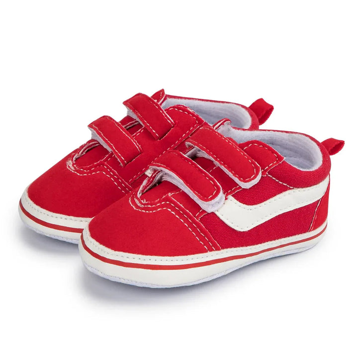 Pair of red-and-white baby sneakers with double hook-and-loop straps