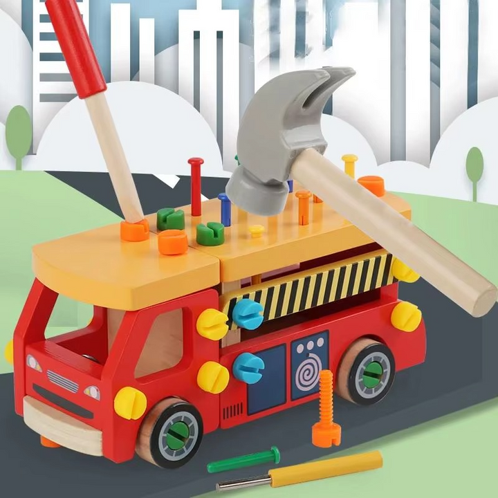 Red wooden construction truck in a play scene with a hammer and screwdriver positioned above the roof