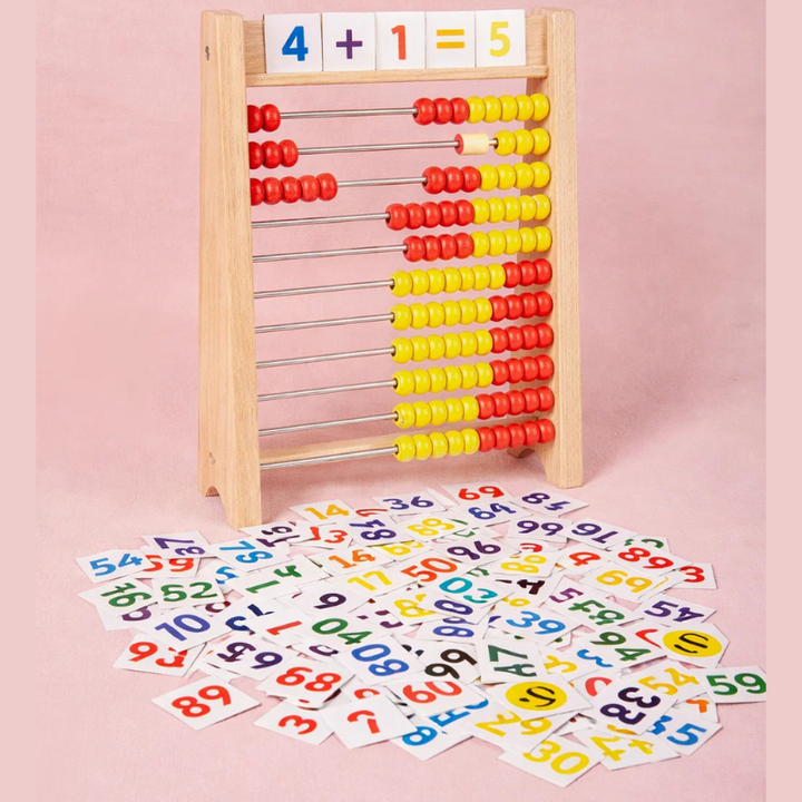 Wooden abacus with red and yellow beads, equation tiles, and loose number tiles