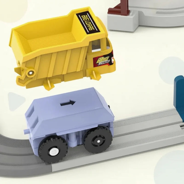 Yellow dump bed shown above the wheeled vehicle chassis