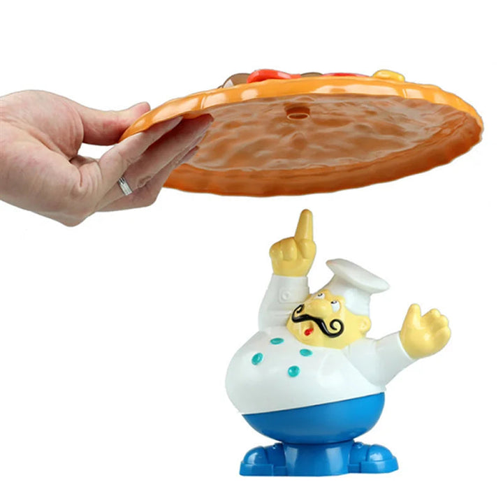 Hand holding the pizza tray above the chef figure&