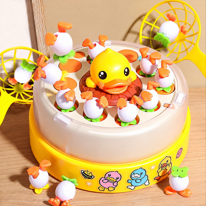 Angled view of a yellow duck game with a central duck figure, egg-shaped pieces, and two nets