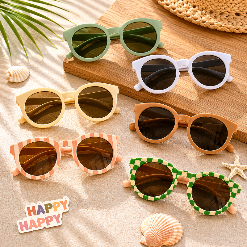 Six pairs of round kids' sunglasses in solid colors and patterned frames.