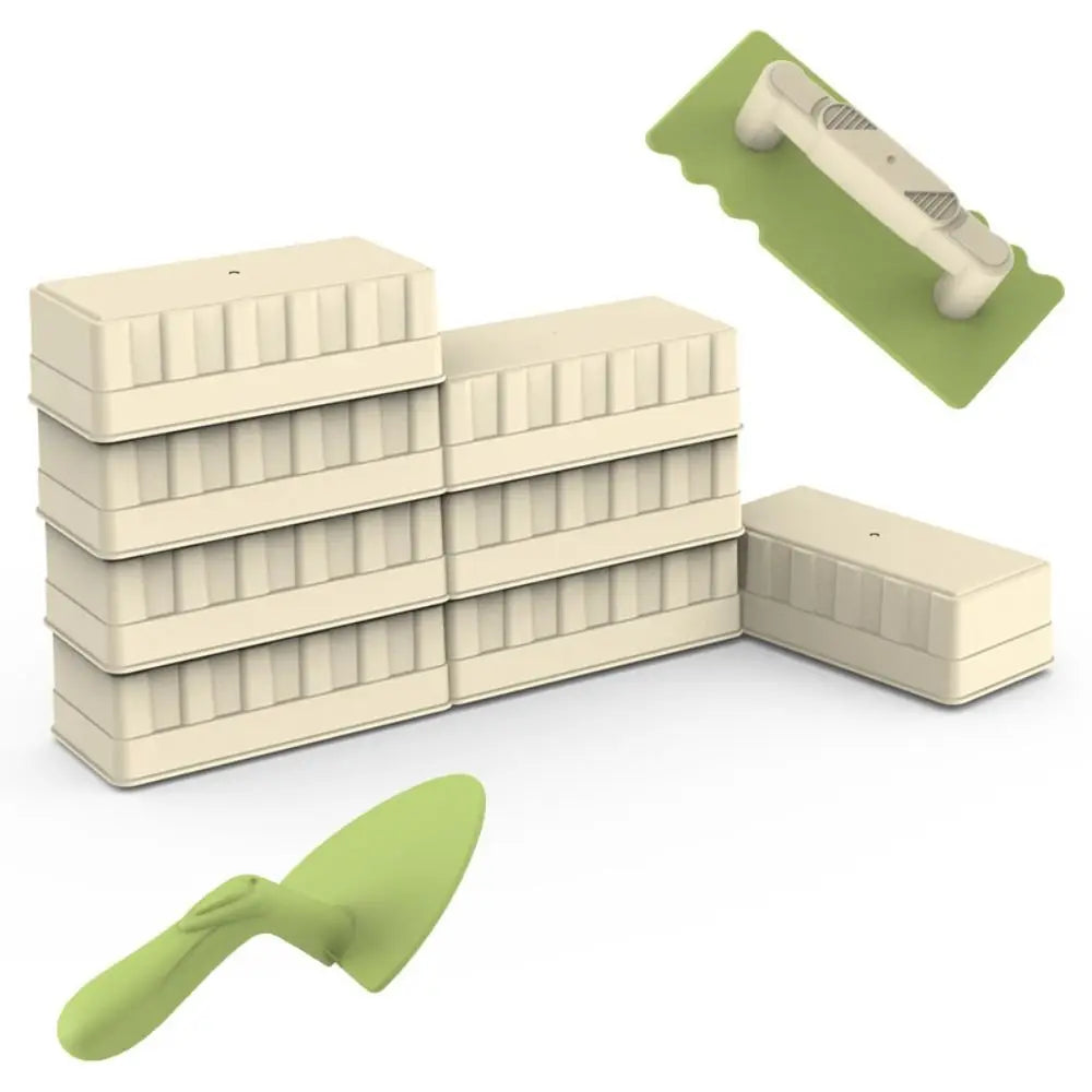 Stacked sand bricks beside a green trowel and cream-handled sand spatula