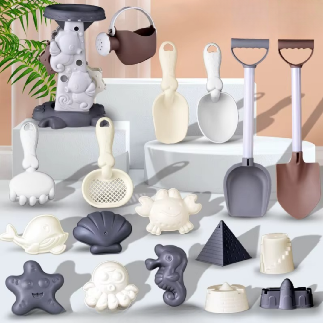 Sand mill and watering can displayed with long shovels, hand tools, and sand molds