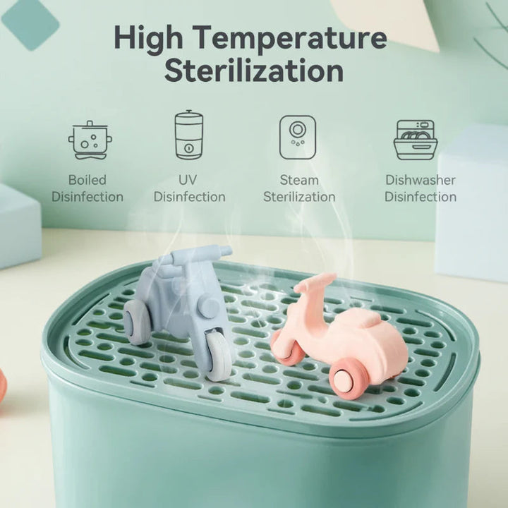 Pink and blue scooter toys displayed on a perforated cleaning tray