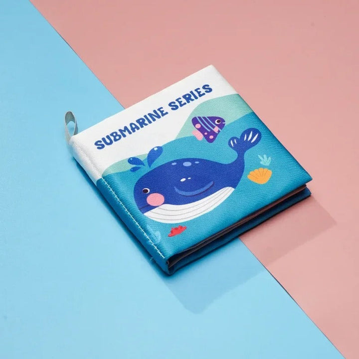 Sea-themed cloth book with a blue whale and fish on the cover