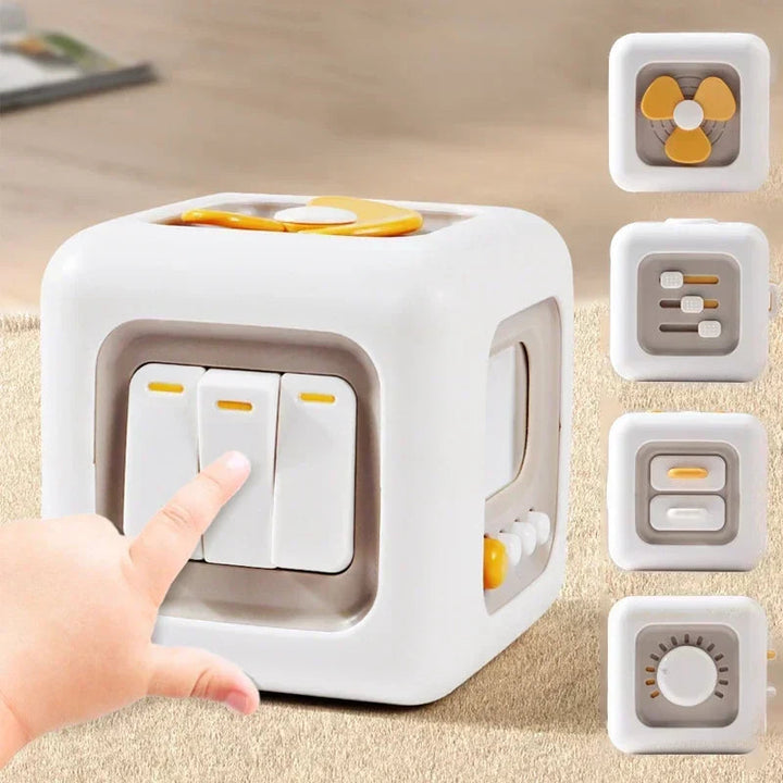 White sensory cube with yellow accents, three press switches, and close-ups of its side activities