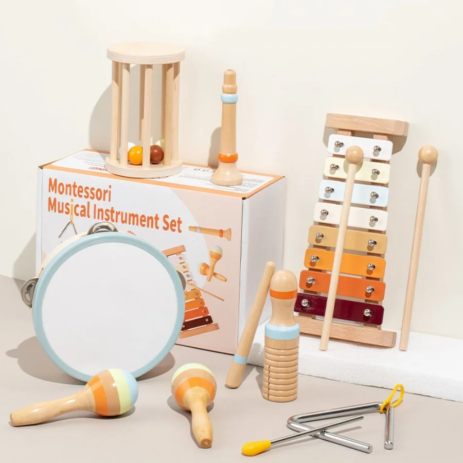 Musical toy assortment with a drum, xylophone, triangle, maracas, wooden scraper, cage rattle and recorder-style toy