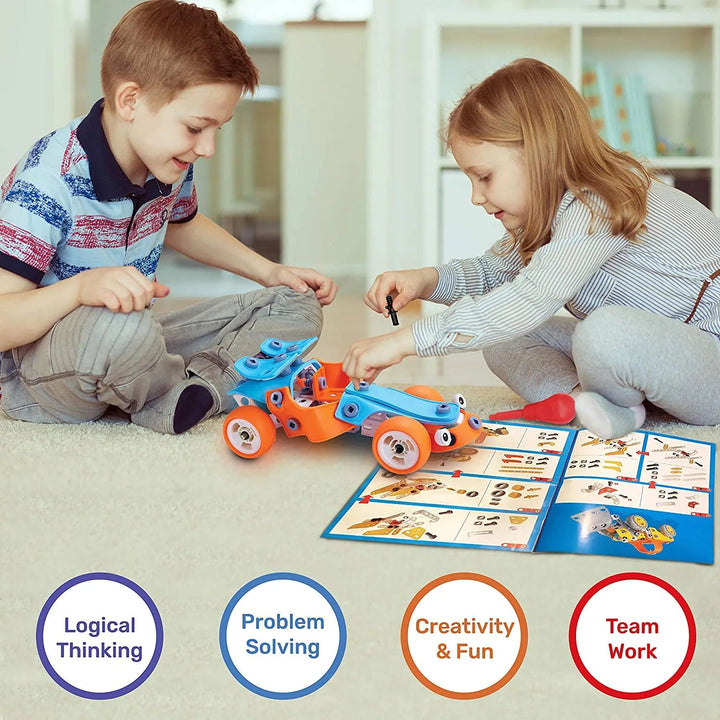 Two children working on a construction car model beside an illustrated building guide