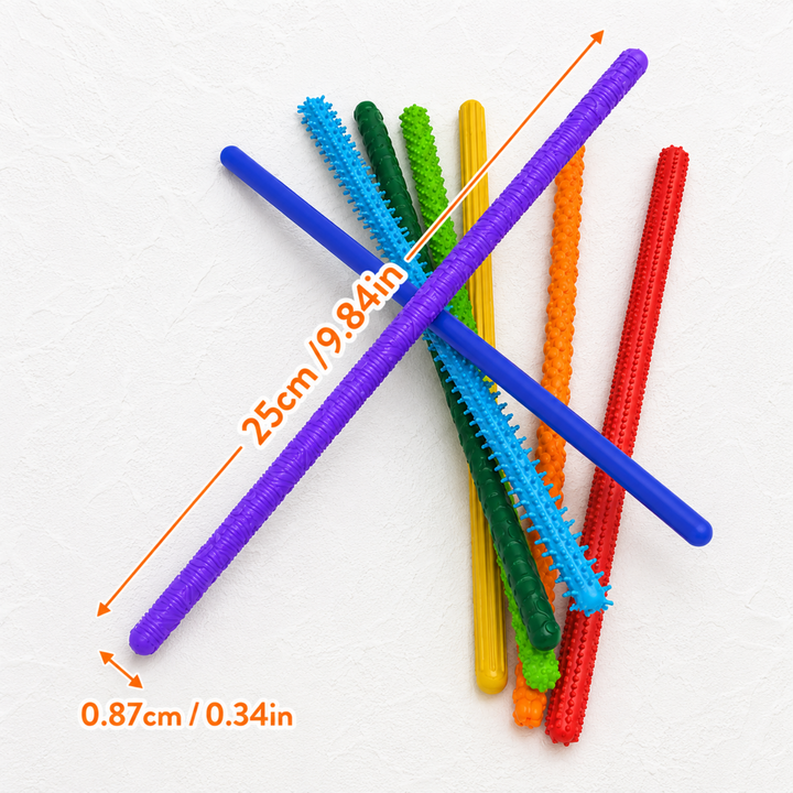 Colorful fidget sticks with measurements showing a length of 25 cm and width of 0.87 cm.