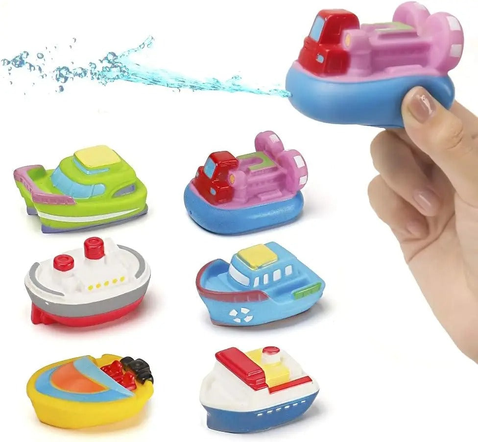 Six colorful bath boats with a pink-and-blue boat held above the assortment and spraying water