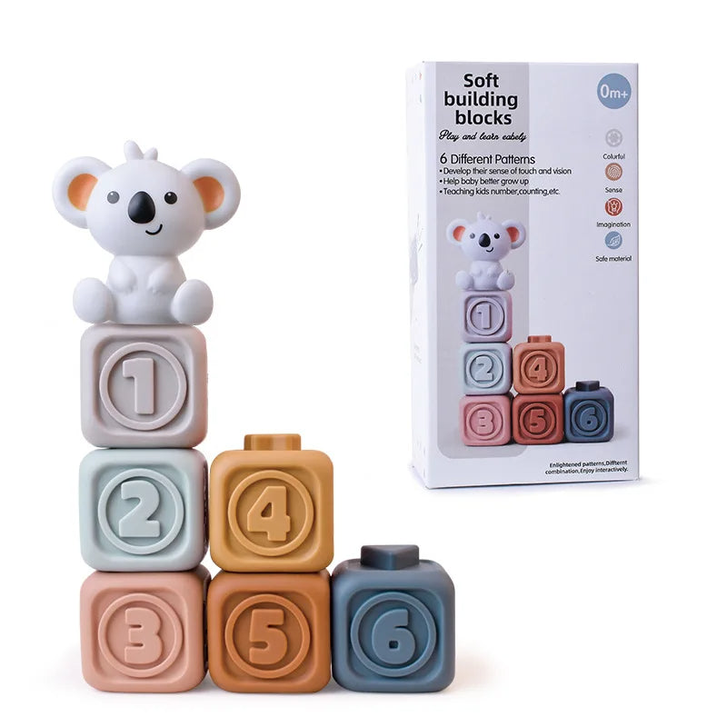 Six numbered stacking cubes with a koala figure and product packaging