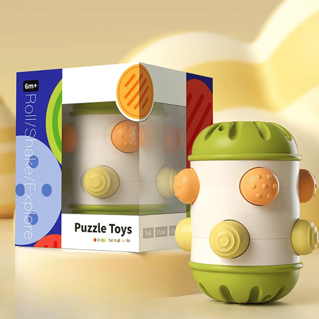 Small green-ended sensory roller with multicolored textured buttons beside its box