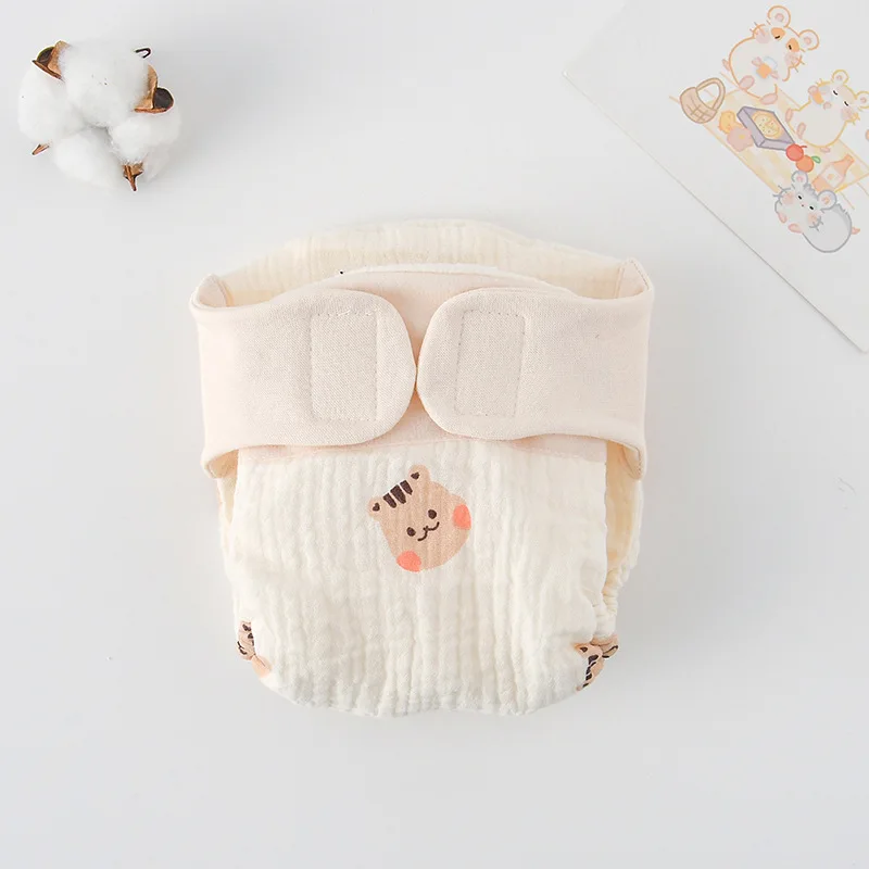 Cloth diaper with small squirrel illustrations and a cream waistband