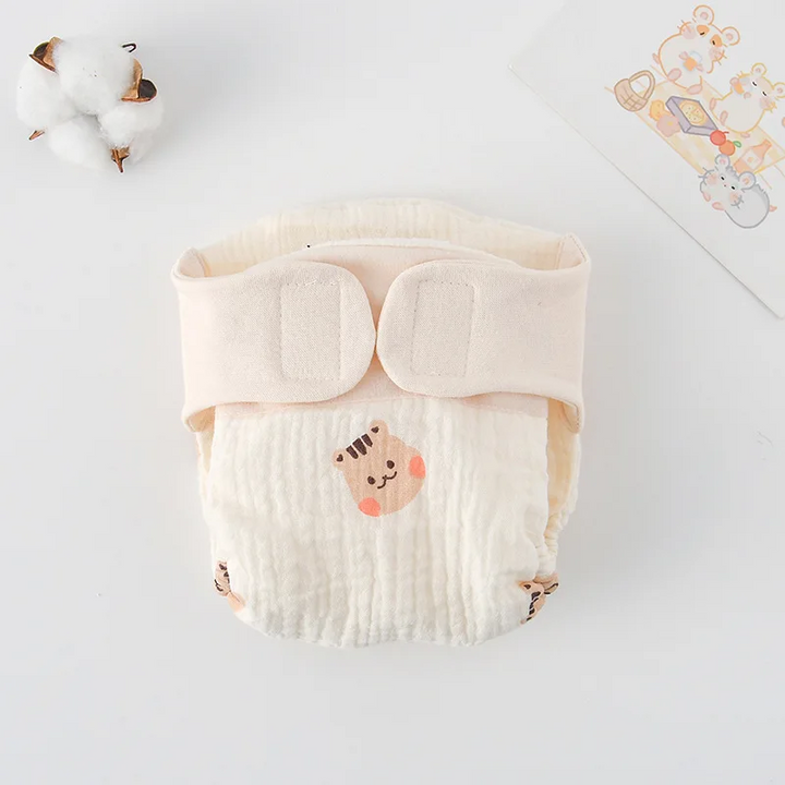 Cloth diaper with small squirrel illustrations and a cream waistband