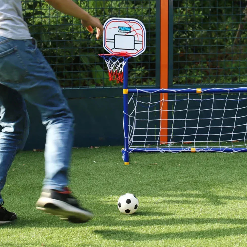 Person approaching a soccer ball in front of the goal and basketball hoop on grass