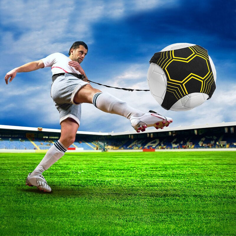 Player kicking a soccer ball connected to a waist belt by a training tether