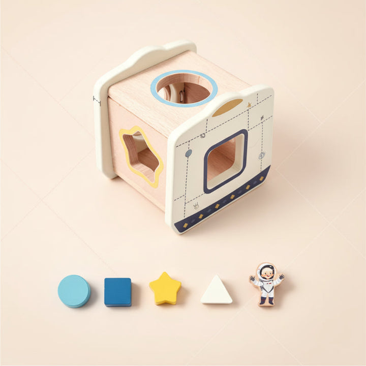 Space capsule wooden shape sorter with circle, square, star, triangle, and astronaut pieces