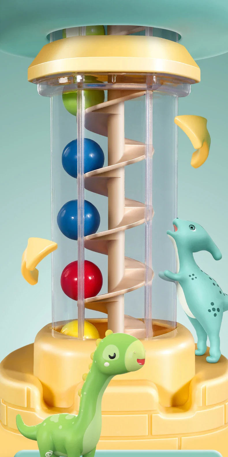 Close-up of colorful balls inside the clear spiral tower on the dinosaur ball catcher.