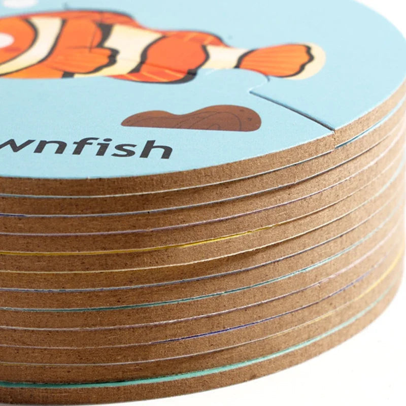 Stacked wooden puzzle circles showing the edges beneath a clownfish illustration