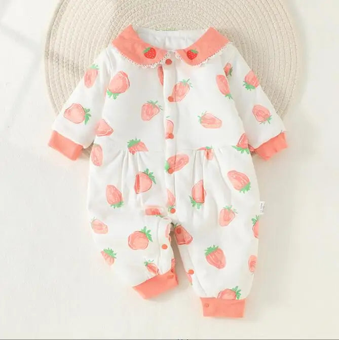 Strawberry-print baby pajamas with a pink collar, matching cuffs, and a gathered waist