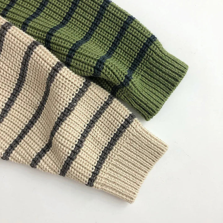 Beige and green striped sweater sleeves with ribbed cuffs