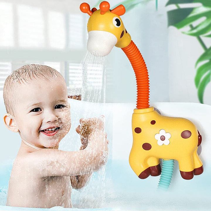 Child playing with the water stream from a yellow giraffe bath toy mounted on the tub wall