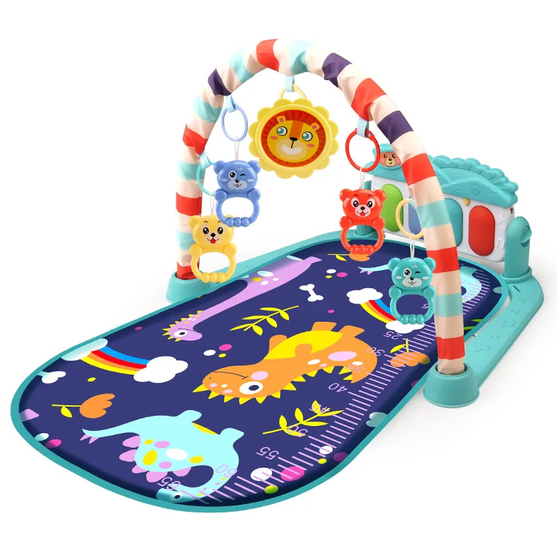 Teal dinosaur baby gym with a dark printed mat and hanging lion toy