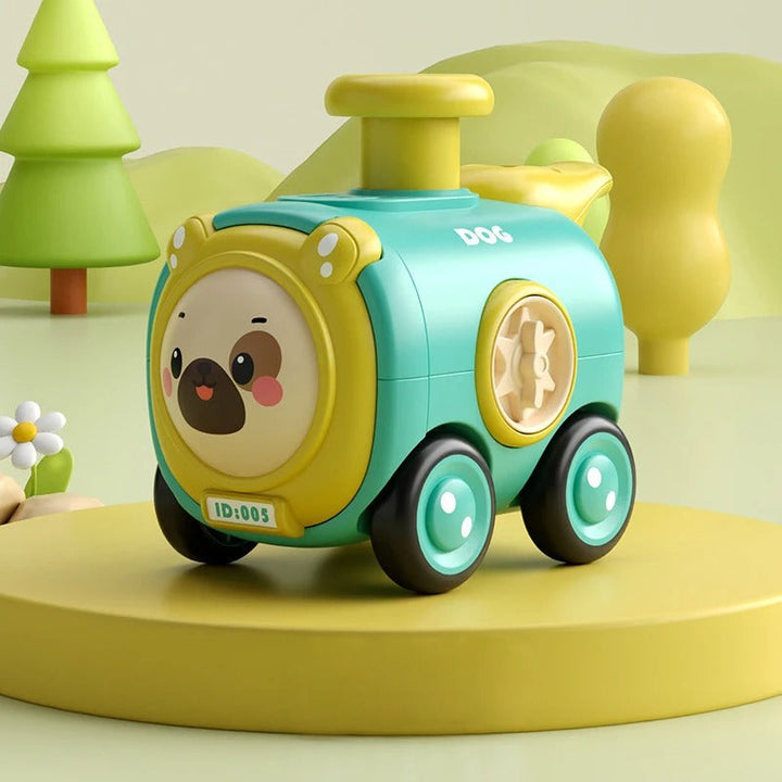 Teal and yellow dog toy train with a dog face, wheels, and a yellow chimney.