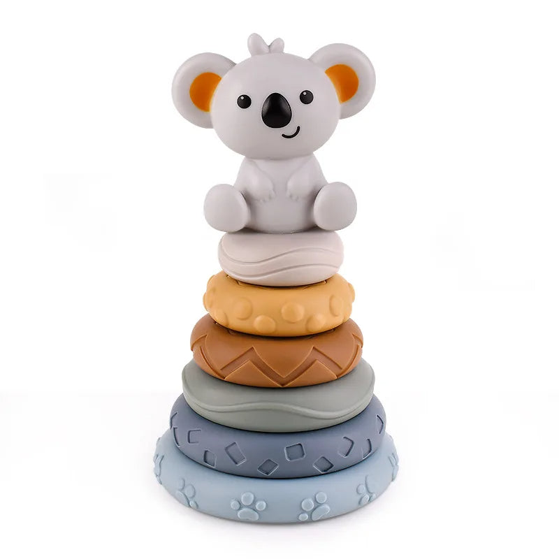 Six textured stacking rings topped with a koala figure