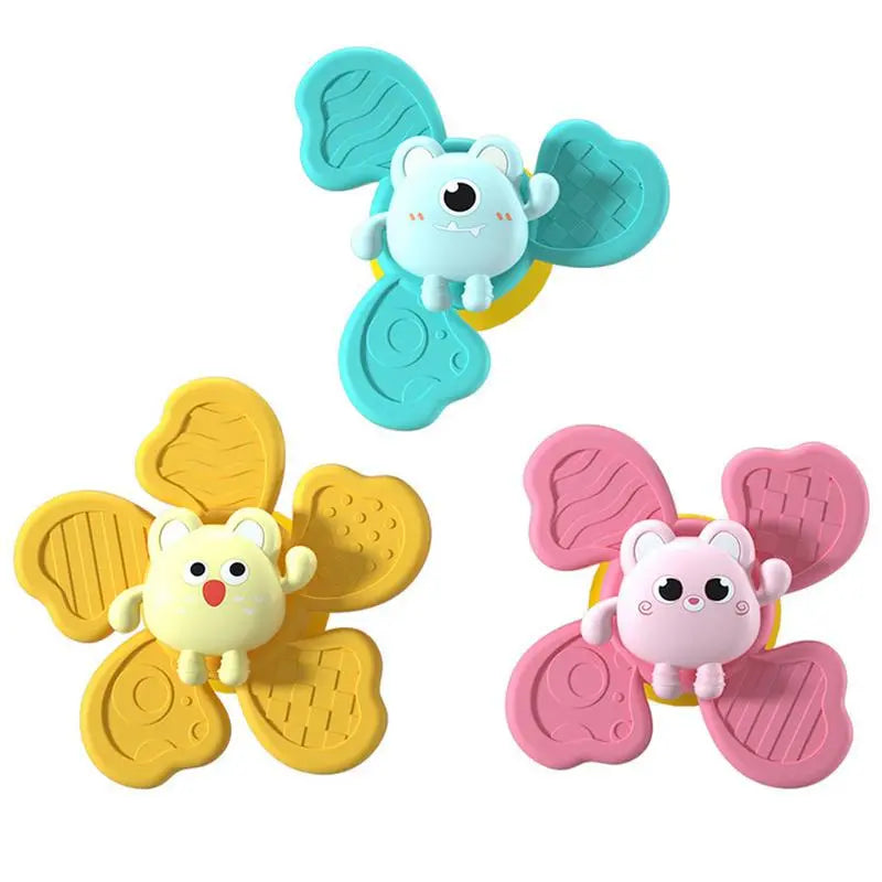Three-piece bath toy set with blue, yellow, and pink animal spinners.