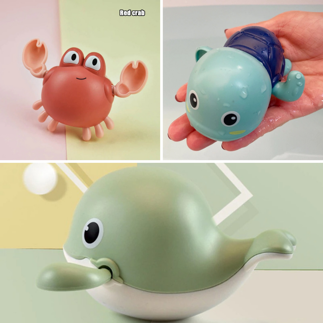 Three-piece bath toy set showing a coral crab, blue turtle, and green whale