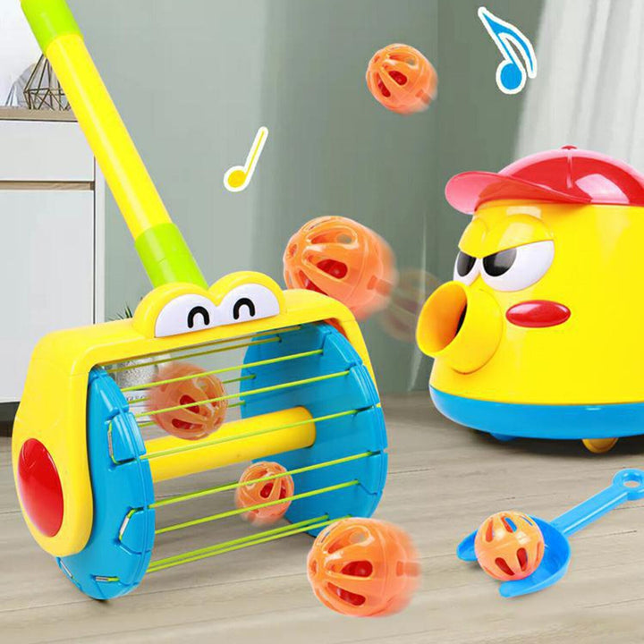 Yellow toy vacuum collecting orange balls beside a matching ball launcher and blue scoop