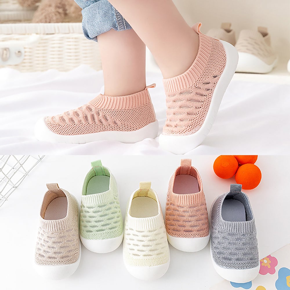 Child wearing pink knit slip-on shoes above a lineup of five color options