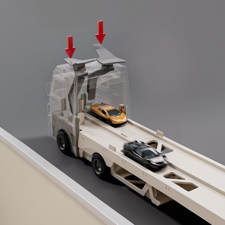 Close-up of the transporter cab with race cars on the lower track and arrows above the top controls