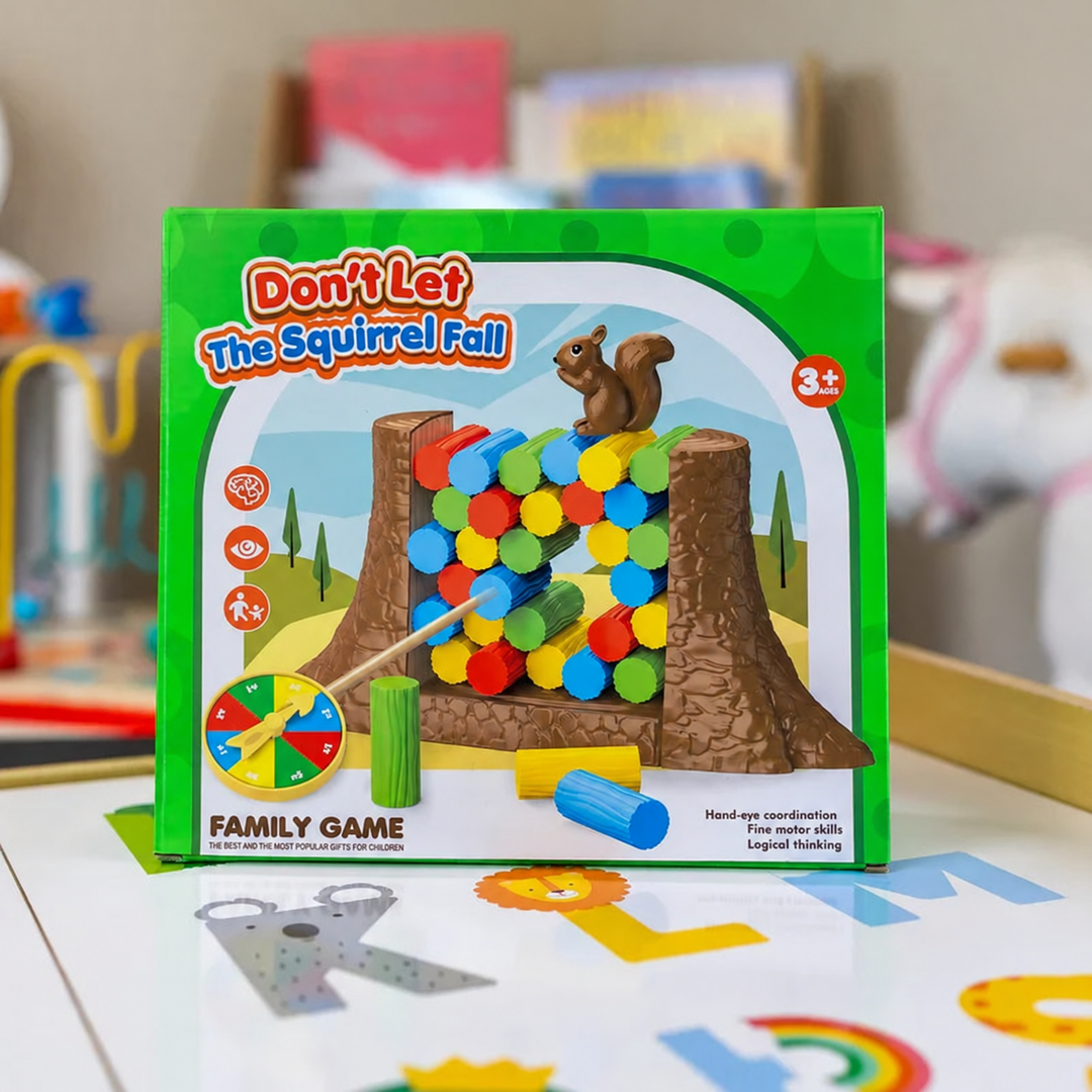 Green game box showing a squirrel balancing on colorful tokens, marked ages 3 and up