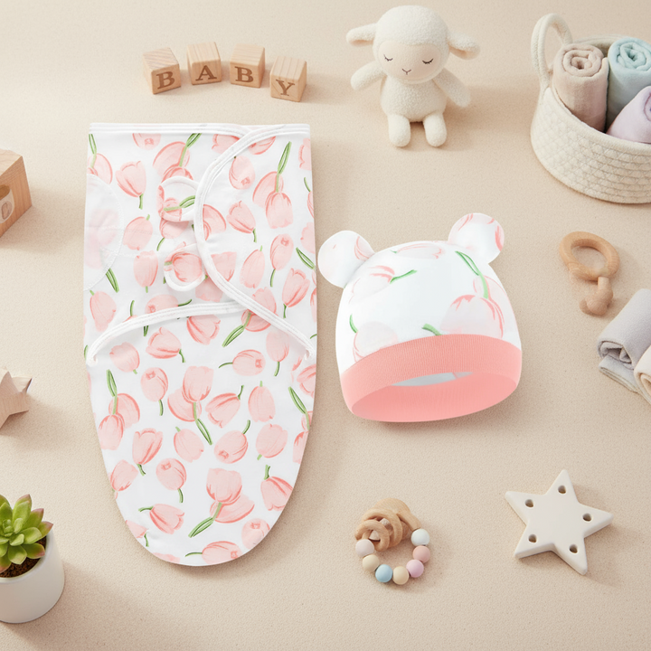 White wrap and matching ear-detail hat with a pink-and-green pattern.