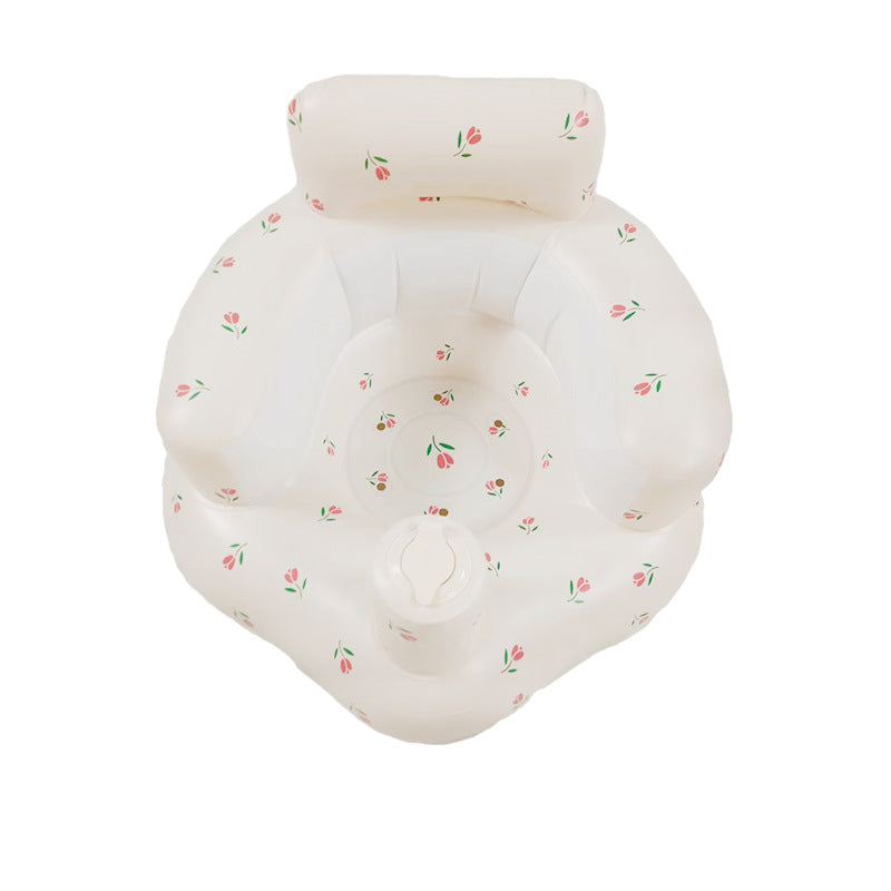 White inflatable baby seat with tulip prints, a raised backrest, and rounded armrests.